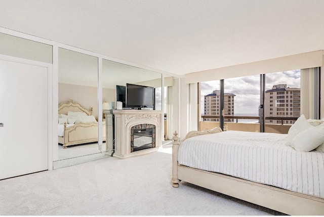 bedroom featuring light colored carpet