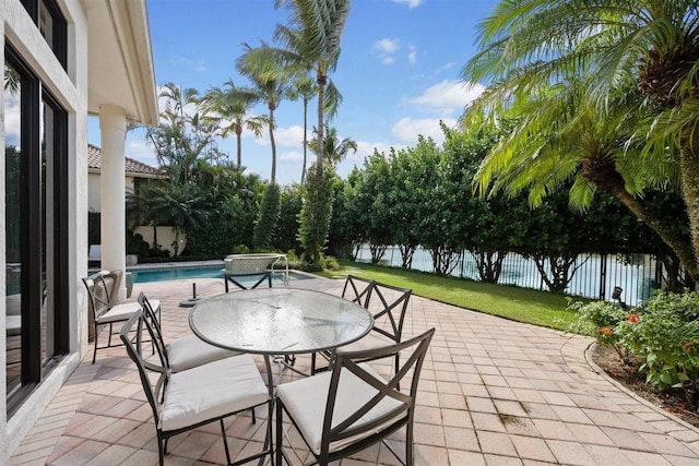 view of patio / terrace with a fenced in pool