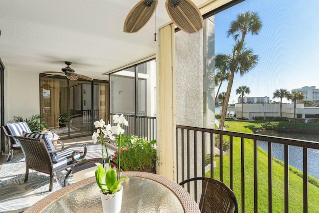 balcony featuring ceiling fan