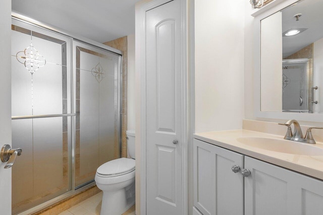 bathroom featuring an inviting chandelier, vanity, toilet, and walk in shower