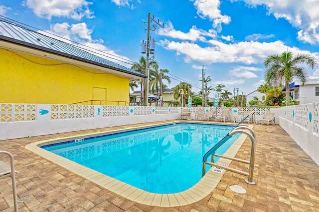 view of pool featuring a patio area