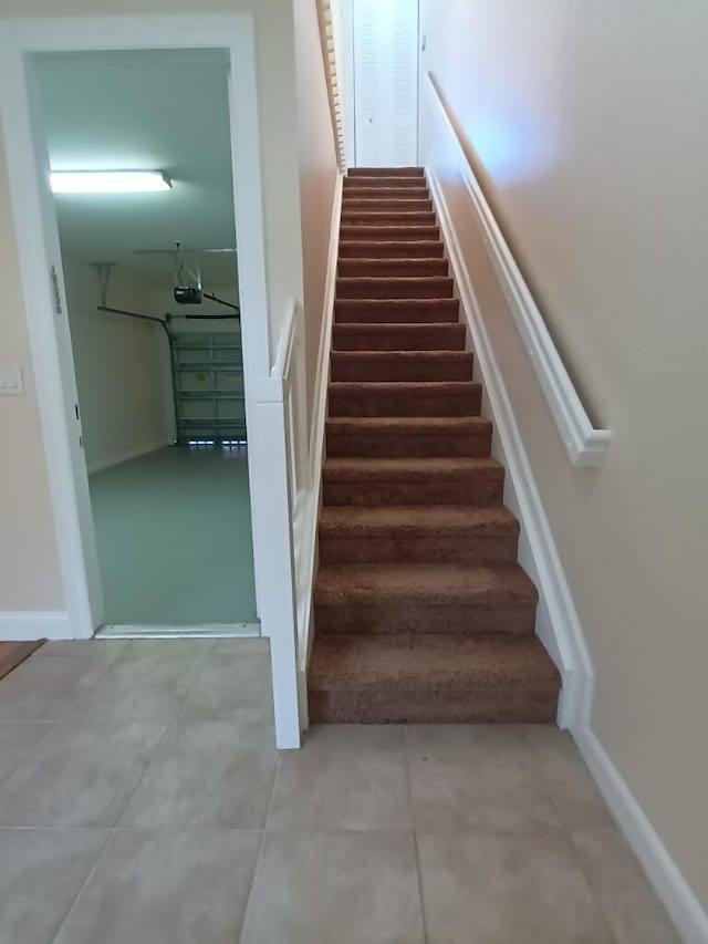 stairs with light tile flooring