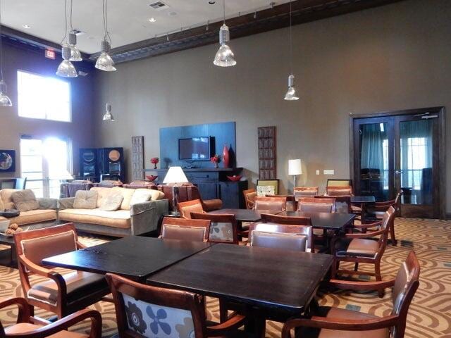 dining room with a high ceiling