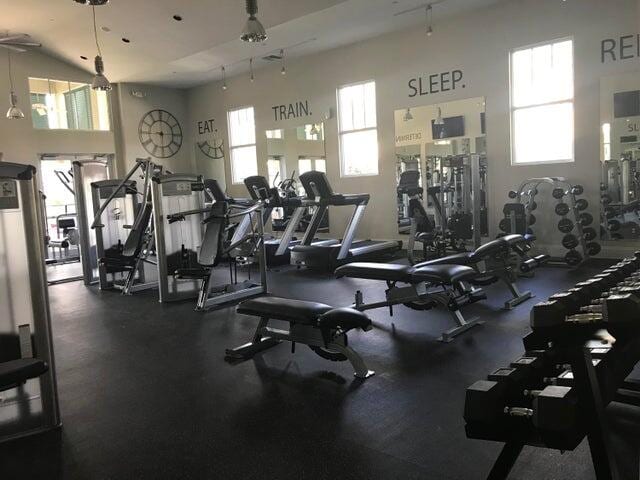 exercise room featuring track lighting