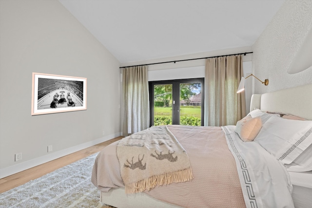 bedroom featuring vaulted ceiling and hardwood / wood-style floors