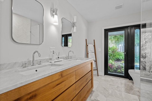 bathroom with vanity and toilet