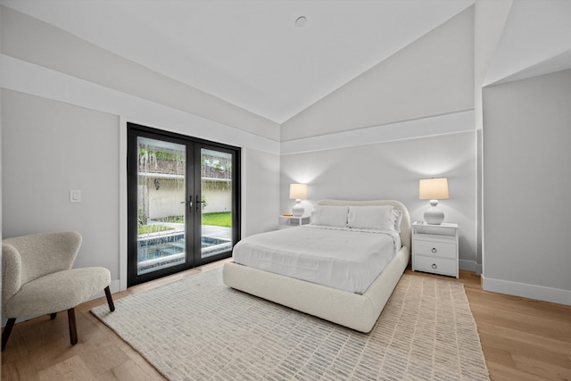 bedroom with french doors, high vaulted ceiling, light hardwood / wood-style flooring, and access to outside