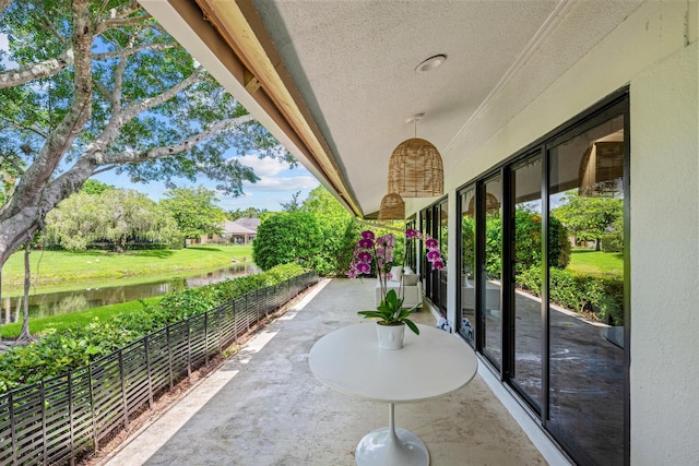 view of patio featuring a water view