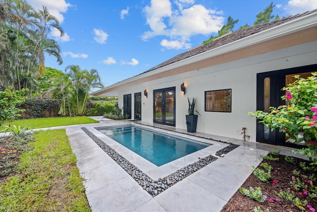 view of pool featuring a patio and french doors