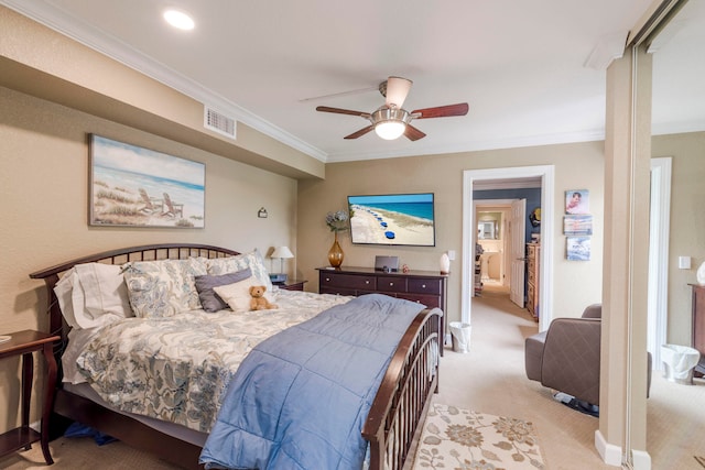 carpeted bedroom featuring ornamental molding and ceiling fan