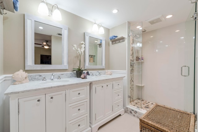 bathroom featuring tile patterned floors, ceiling fan, an enclosed shower, and vanity