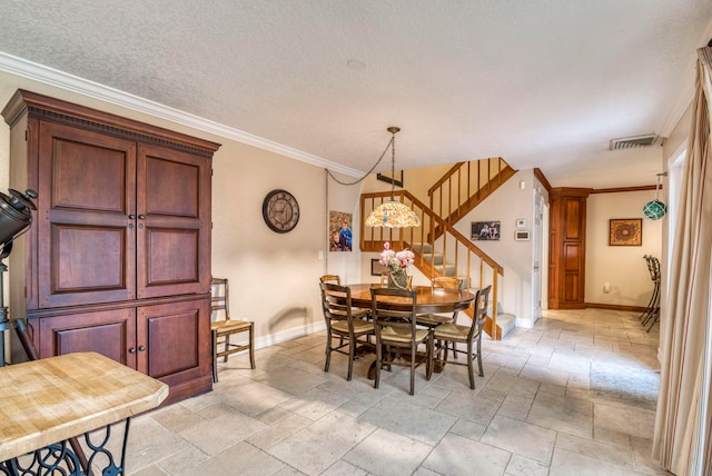 dining space with crown molding and a textured ceiling