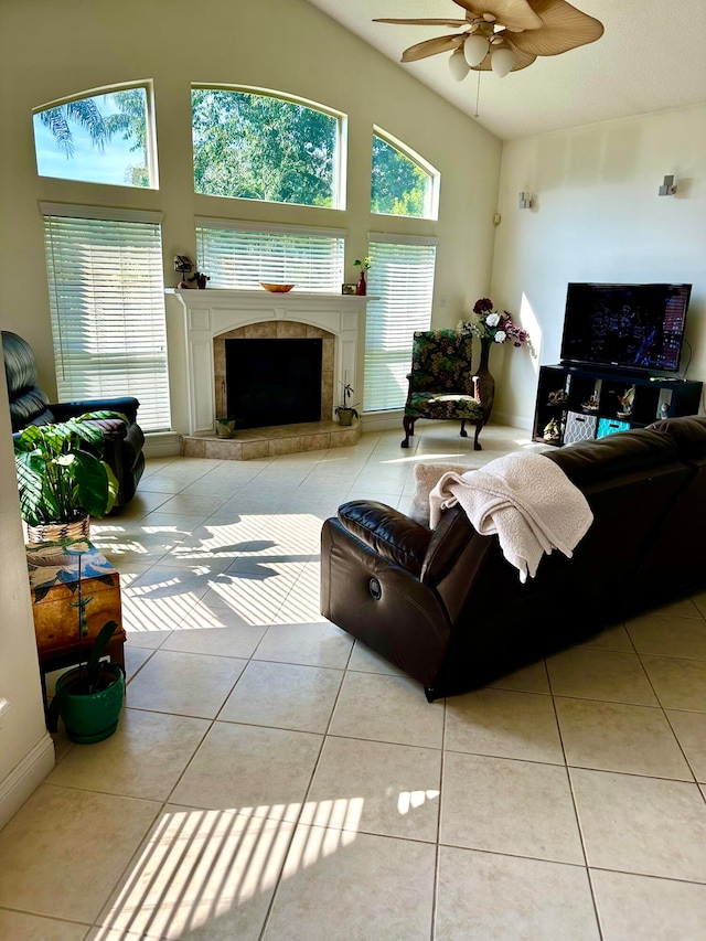 tiled living room featuring ceiling fan