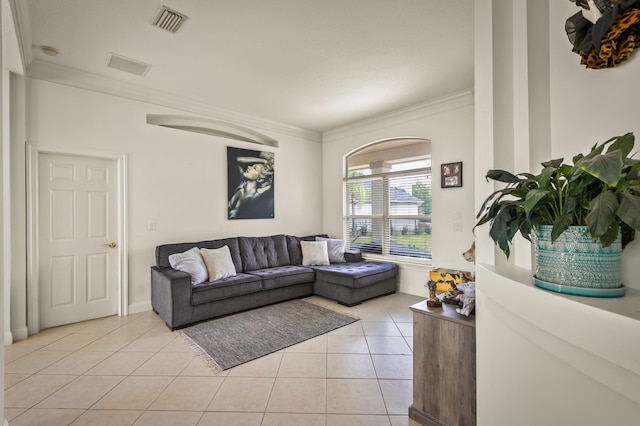 living room featuring light tile patterned flooring and ornamental molding