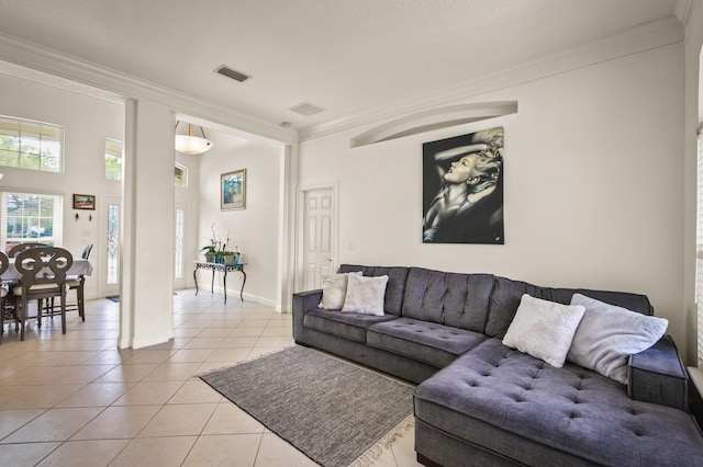 tiled living room featuring ornamental molding