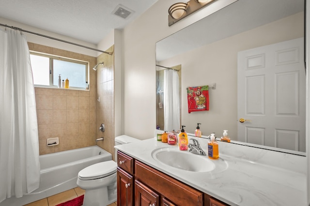 full bathroom with shower / tub combo, a textured ceiling, toilet, tile patterned floors, and vanity