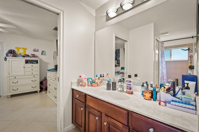 bathroom featuring vanity and tile patterned flooring