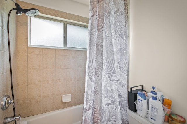 bathroom with shower / bath combo with shower curtain