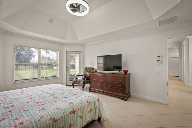 tiled bedroom featuring a raised ceiling