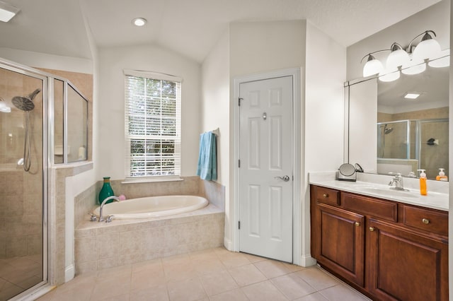 bathroom with shower with separate bathtub, vanity, tile patterned flooring, and vaulted ceiling