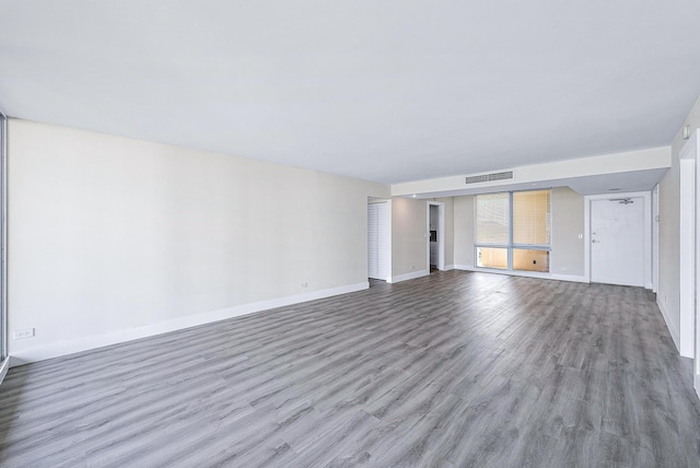 unfurnished living room featuring light wood-type flooring