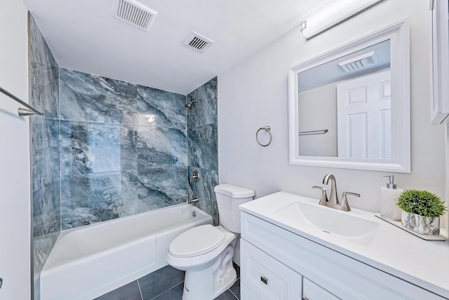 full bathroom with tiled shower / bath combo, toilet, tile floors, and large vanity