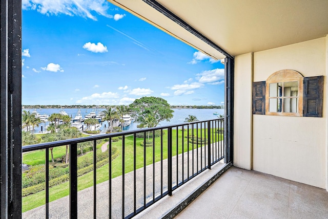 balcony featuring a water view