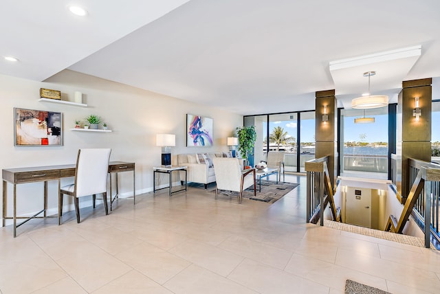 dining area featuring light tile floors and expansive windows