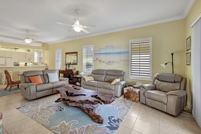 living room with crown molding, light tile flooring, and ceiling fan