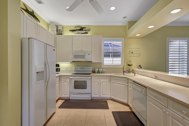 kitchen featuring ceiling fan, white appliances, sink, light tile floors, and white cabinets