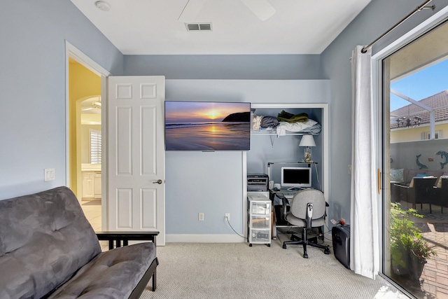 office area with light carpet and ceiling fan