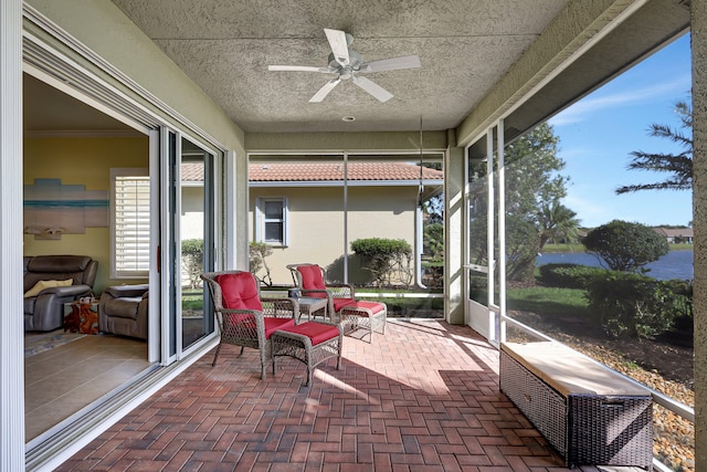 sunroom / solarium with ceiling fan