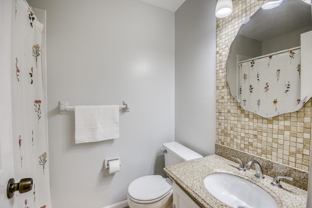 full bath with toilet, decorative backsplash, and vanity