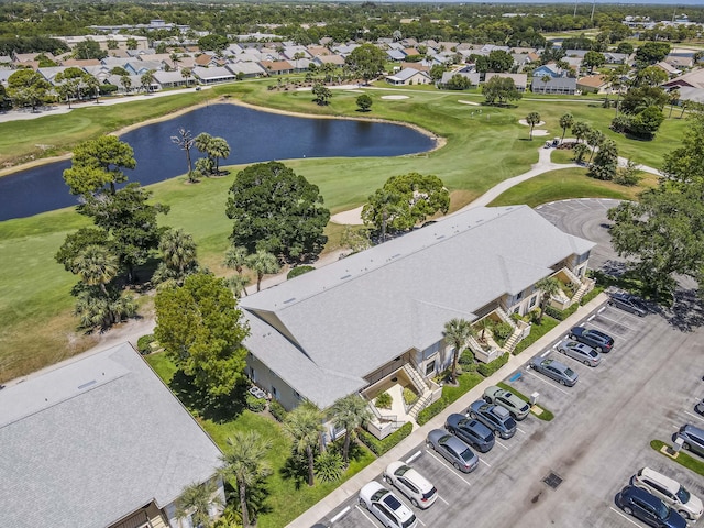 aerial perspective of suburban area with a large body of water and a golf course