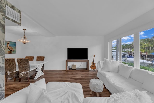 living room featuring dark hardwood / wood-style floors and an inviting chandelier