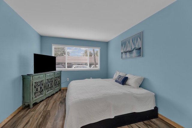 bedroom featuring dark wood-type flooring