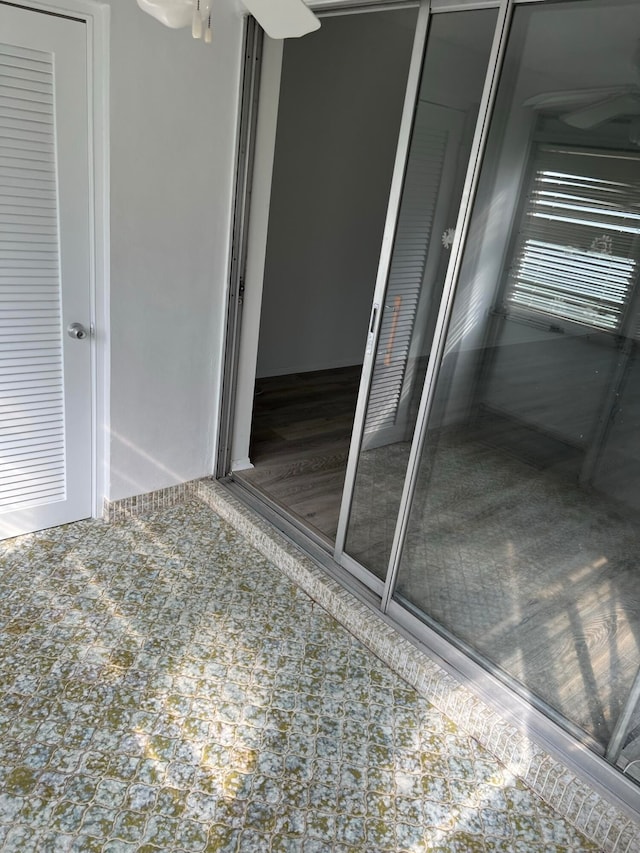 unfurnished bedroom featuring dark tile floors