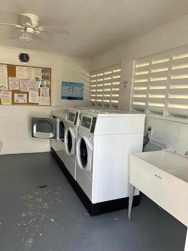 laundry room with sink, ceiling fan, and washing machine and clothes dryer