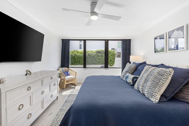 bedroom with ceiling fan and light hardwood / wood-style flooring