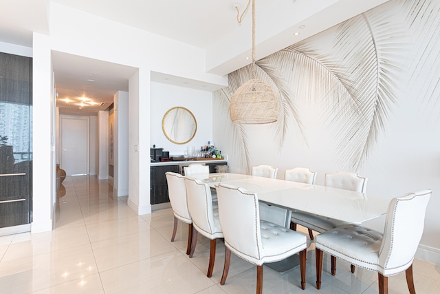 dining space featuring light tile patterned flooring