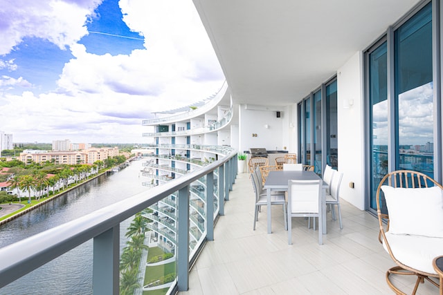 balcony featuring a water view