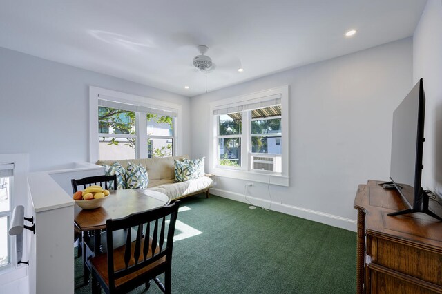 carpeted dining space featuring ceiling fan and cooling unit