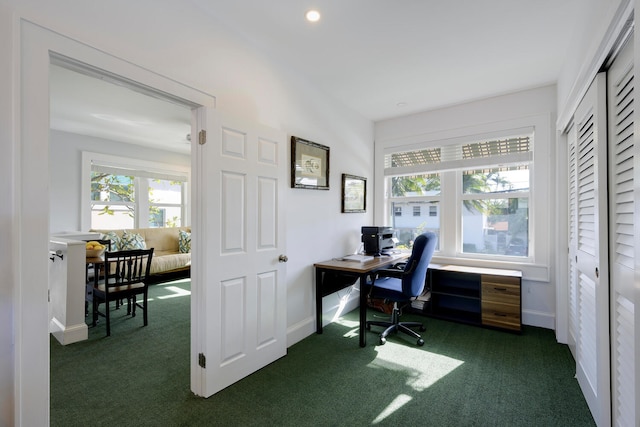 office space featuring baseboards, dark carpet, and recessed lighting