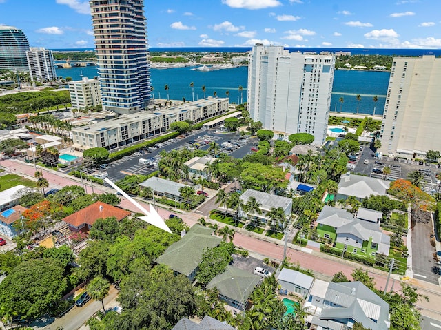 birds eye view of property with a view of city and a water view