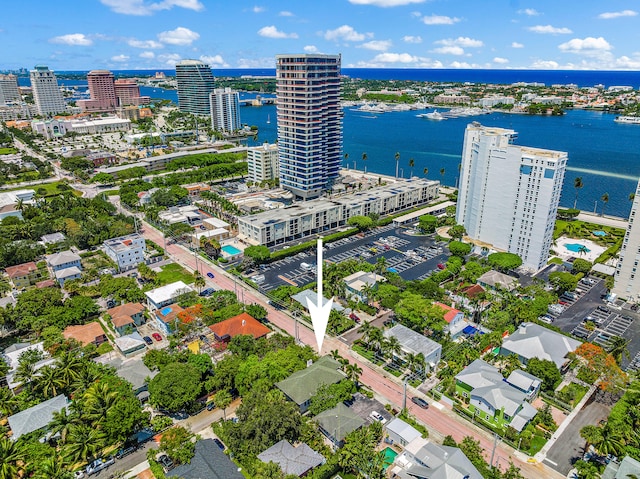 birds eye view of property with a water view