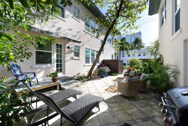 view of patio with fence and grilling area