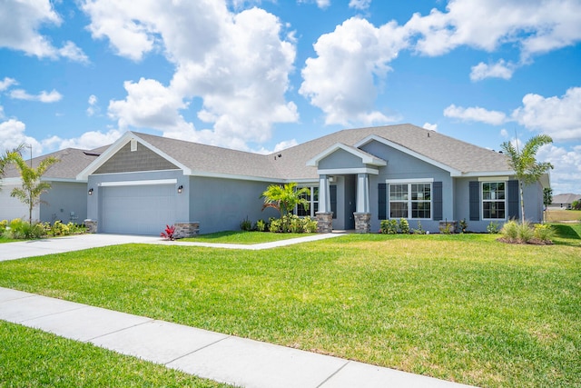 craftsman-style home with a garage and a front yard