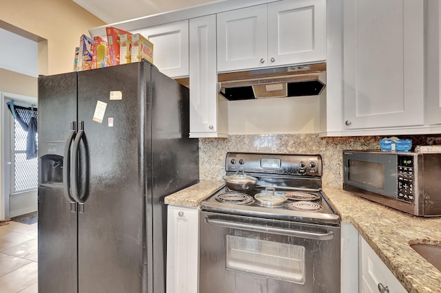 kitchen with black refrigerator with ice dispenser, white cabinetry, range with electric stovetop, light stone counters, and tasteful backsplash