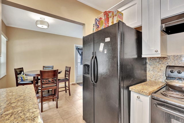 kitchen featuring black refrigerator with ice dispenser, white cabinetry, backsplash, light tile flooring, and electric stove