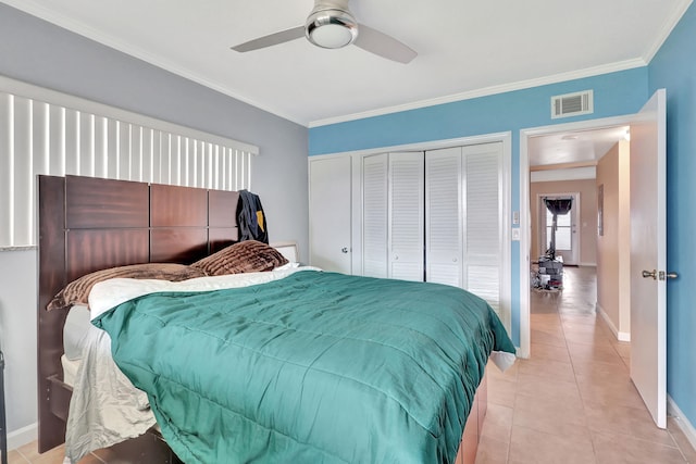 bedroom with light tile floors, crown molding, and ceiling fan